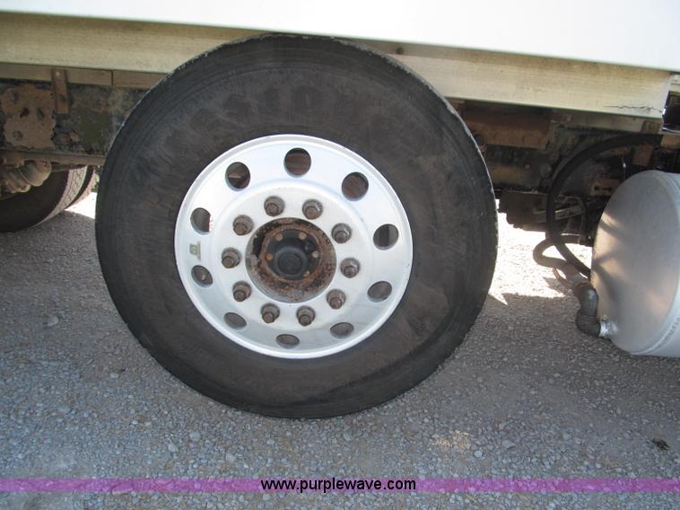 image for item F7115 2001 Freightliner FLD120 tri axle dump truck