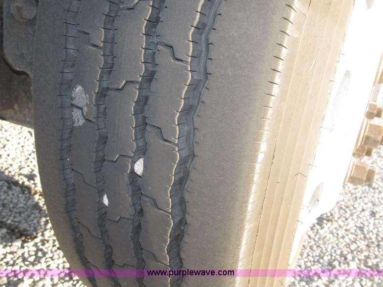 image for item F7116 2007 Freightliner FLD132 XL Classic tri axle semi truck