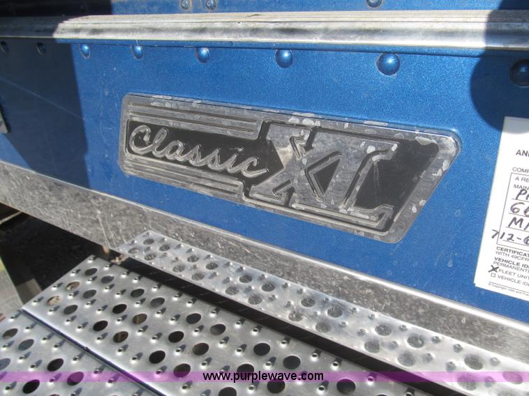 image for item F7116 2007 Freightliner FLD132 XL Classic tri axle semi truck