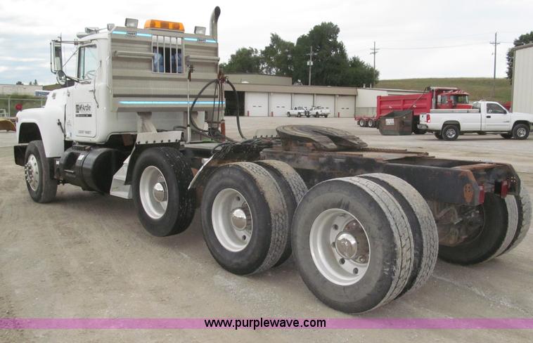 image for item F7122 1985 Mack RD688S Econodyne triple axle semi truck