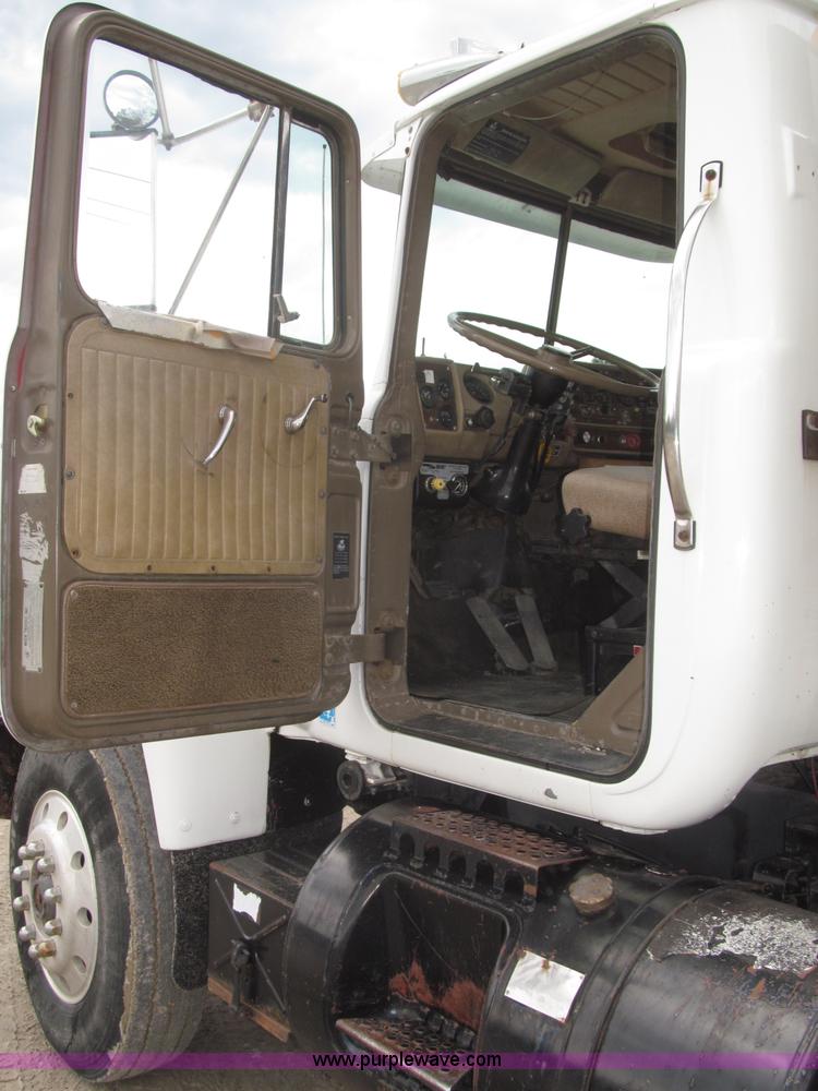 image for item F7122 1985 Mack RD688S Econodyne triple axle semi truck