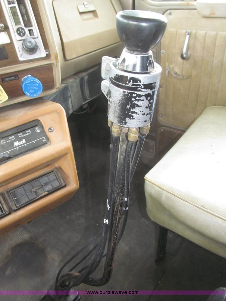 image for item F7122 1985 Mack RD688S Econodyne triple axle semi truck