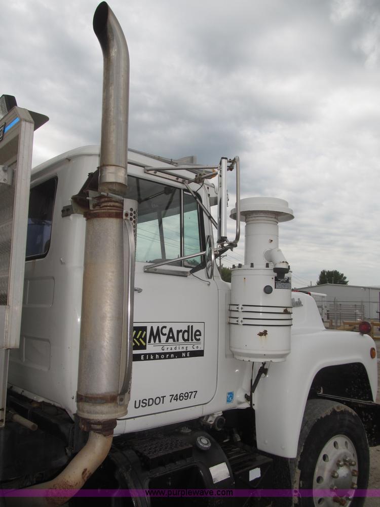 image for item F7122 1985 Mack RD688S Econodyne triple axle semi truck