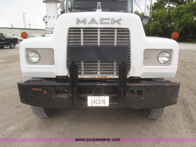 image for item F7122 1985 Mack RD688S Econodyne triple axle semi truck
