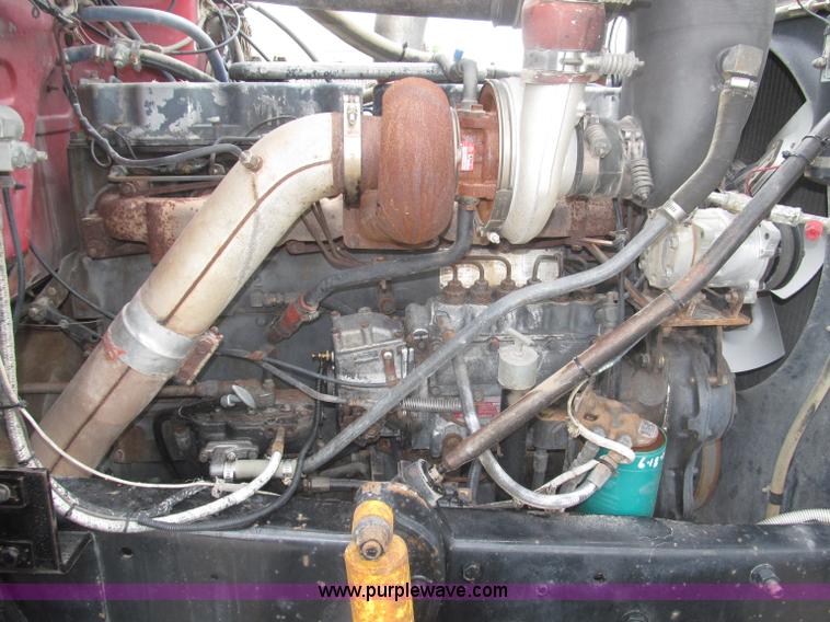 image for item F7122 1985 Mack RD688S Econodyne triple axle semi truck