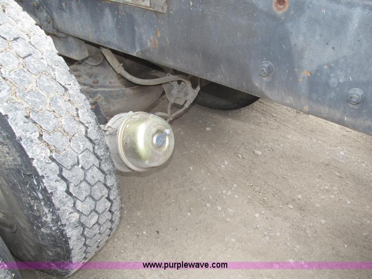 image for item F7122 1985 Mack RD688S Econodyne triple axle semi truck