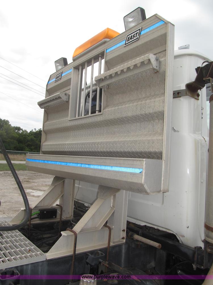 image for item F7122 1985 Mack RD688S Econodyne triple axle semi truck