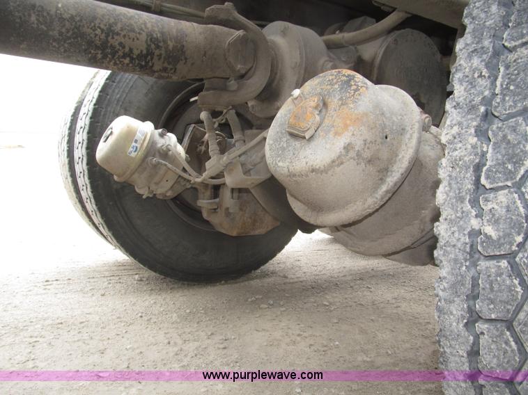 image for item F7122 1985 Mack RD688S Econodyne triple axle semi truck