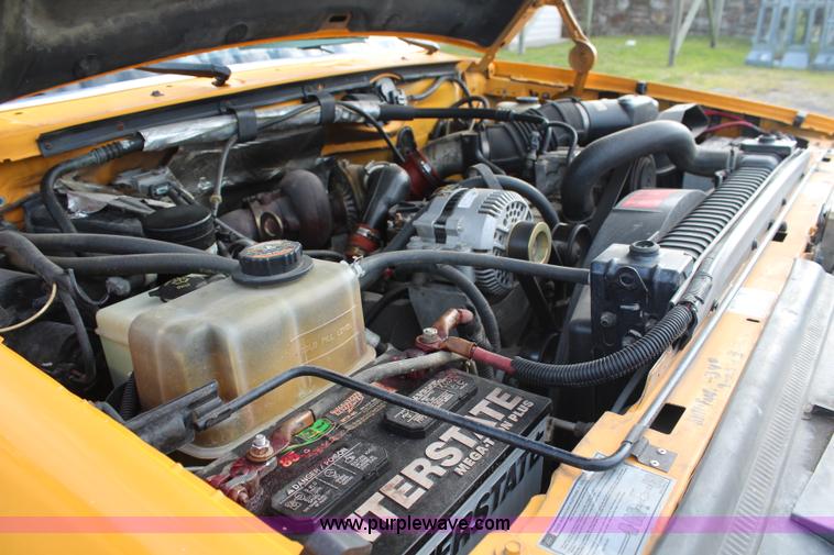 image for item H6687 1997 Ford F450 XL Super Duty flatbed truck with paint striping unit