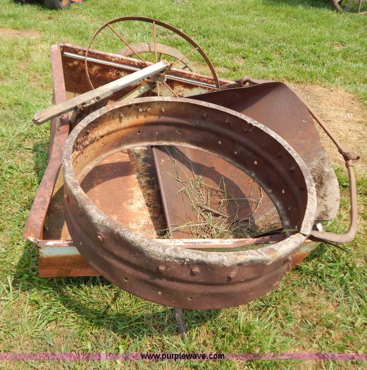 Antique pond scoop and two steel wagon wheels in Verona, MO Item