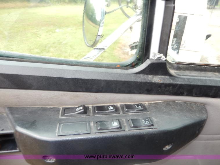 image for item I4302 2003 Freightliner FL70 semi truck