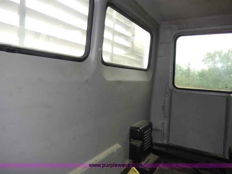 image for item I4302 2003 Freightliner FL70 semi truck