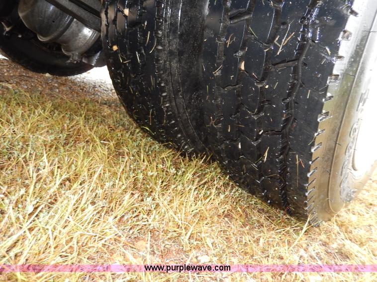 image for item I4302 2003 Freightliner FL70 semi truck