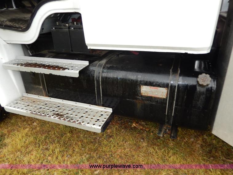 image for item I4302 2003 Freightliner FL70 semi truck