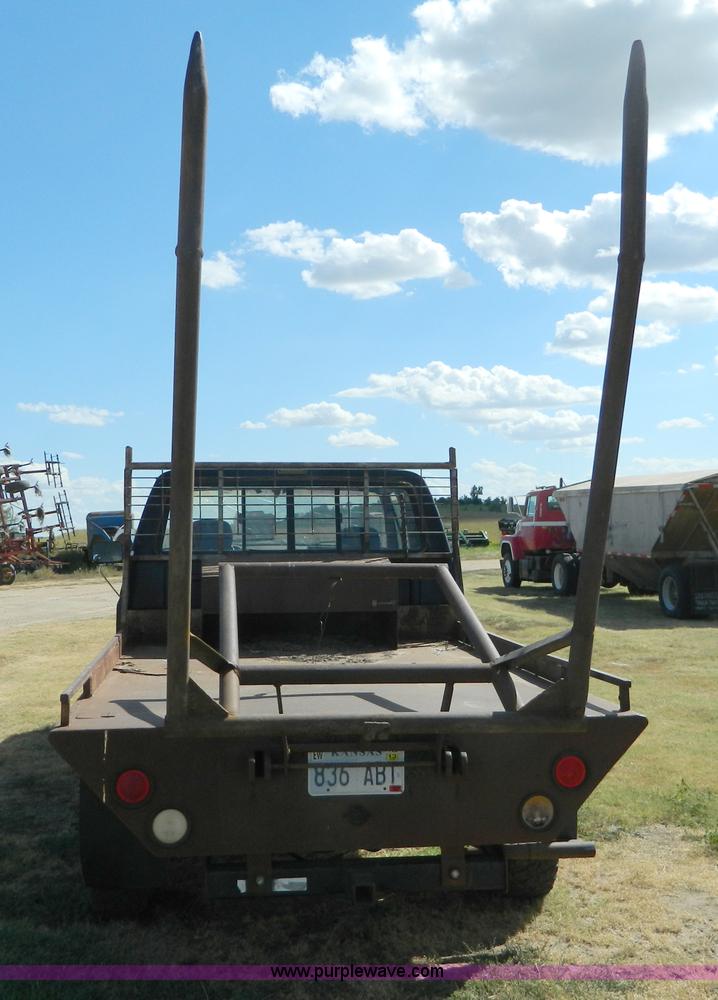 image for item D6033 1989 Ford F250 HD SuperCab flatbed truck