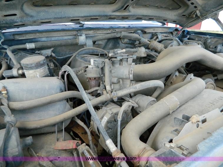 image for item D6033 1989 Ford F250 HD SuperCab flatbed truck