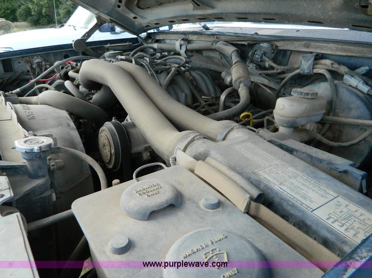 image for item D6033 1989 Ford F250 HD SuperCab flatbed truck