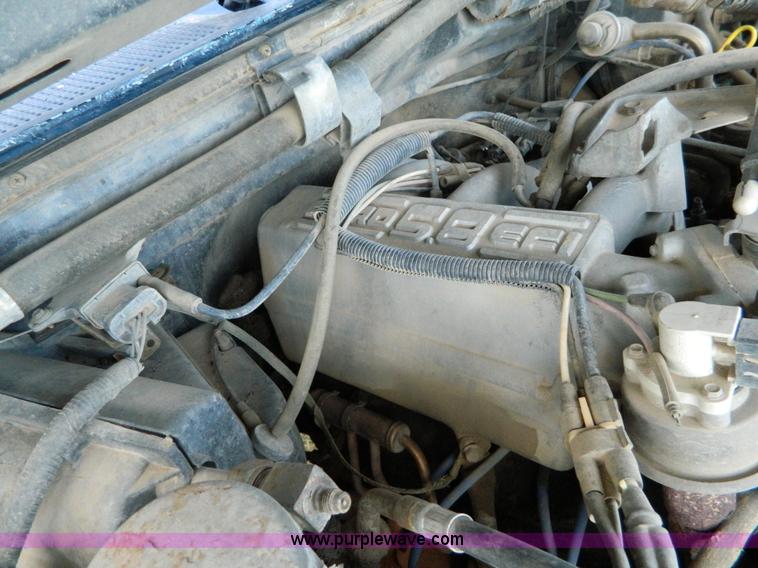 image for item D6033 1989 Ford F250 HD SuperCab flatbed truck