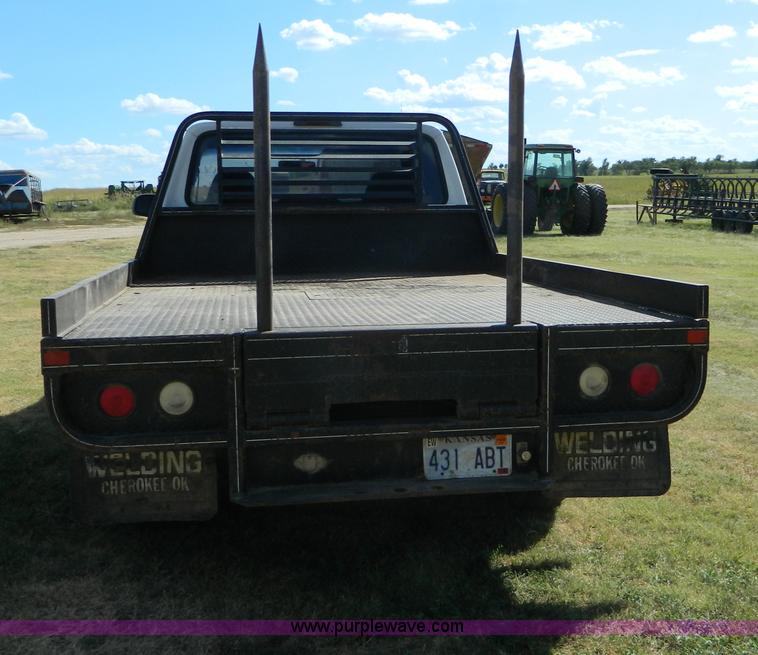 image for item D6034 1996 Ford F250 XL SuperCab flatbed truck