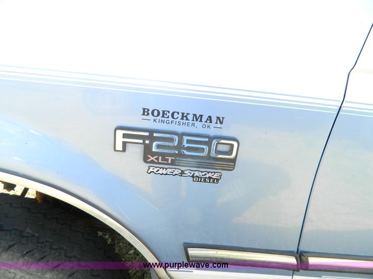 image for item D6034 1996 Ford F250 XL SuperCab flatbed truck