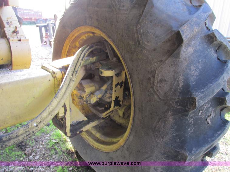 image for item F5297 1981 New Holland TR85 RWA combine with header