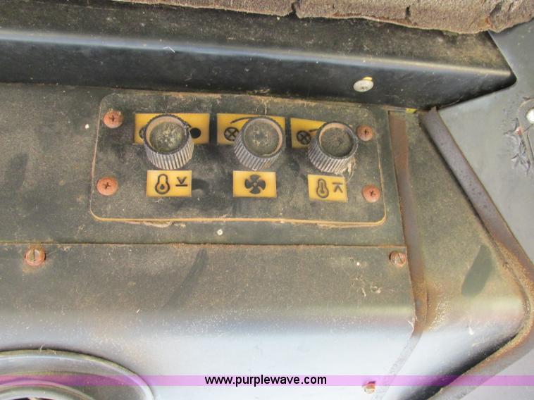 image for item F5297 1981 New Holland TR85 RWA combine with header