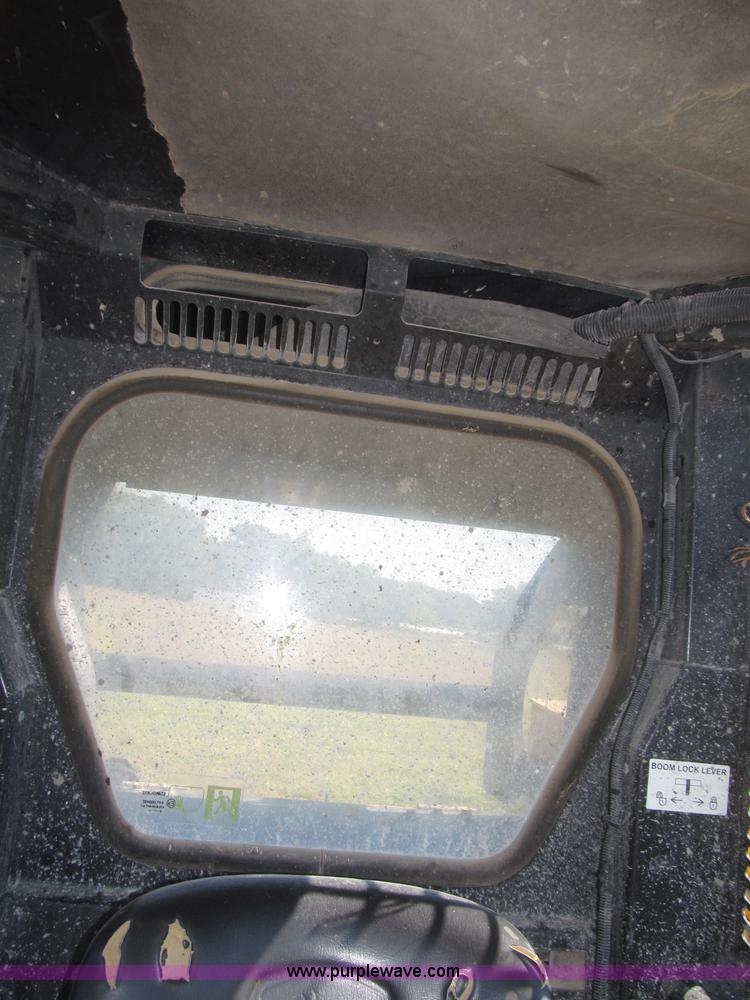 image for item F7134 John Deere 325 skid steer