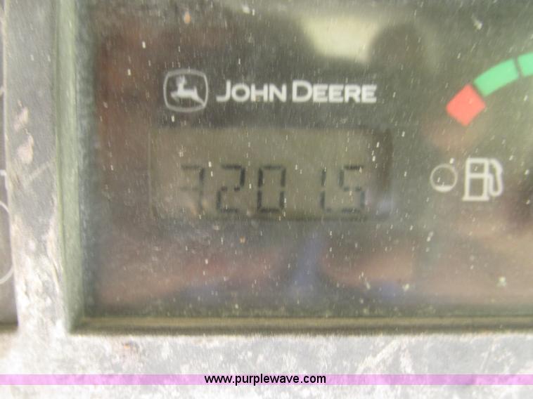 image for item F7134 John Deere 325 skid steer