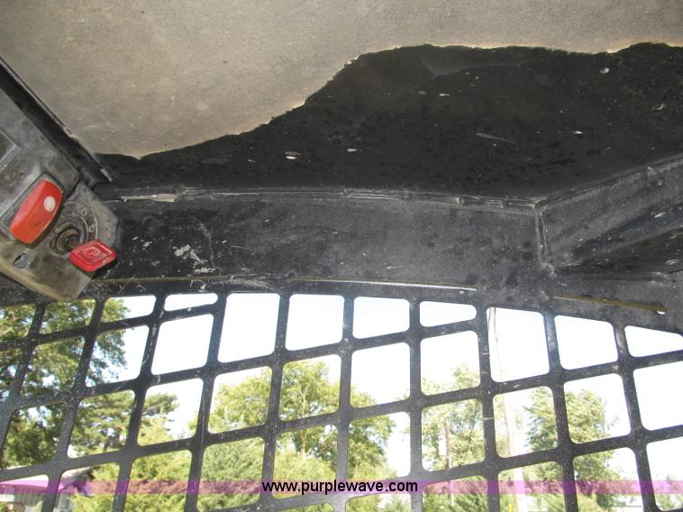 image for item F7134 John Deere 325 skid steer