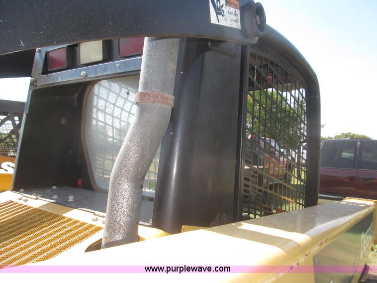 image for item F7134 John Deere 325 skid steer