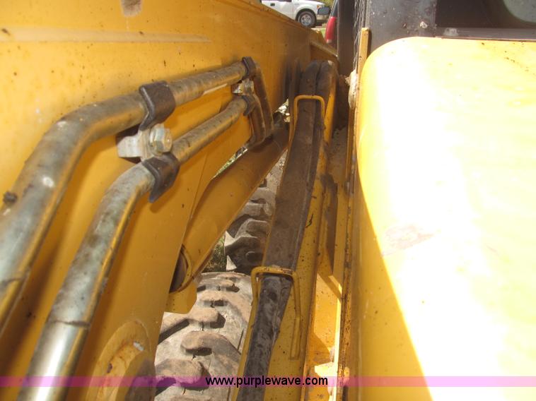 image for item F7134 John Deere 325 skid steer