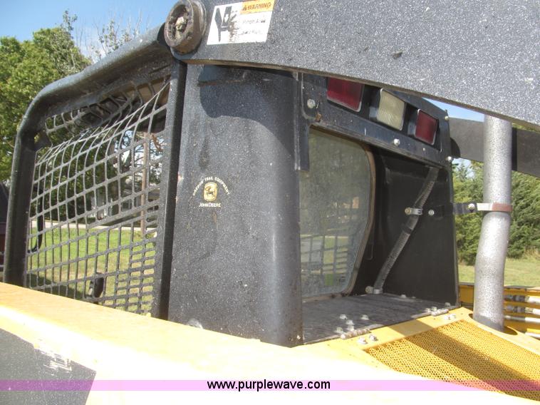 image for item F7134 John Deere 325 skid steer