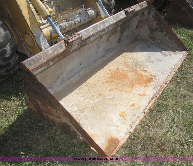 image for item F7134 John Deere 325 skid steer