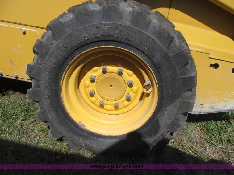 image for item F7134 John Deere 325 skid steer