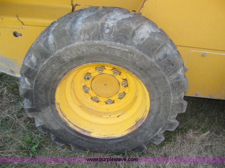 image for item F7134 John Deere 325 skid steer