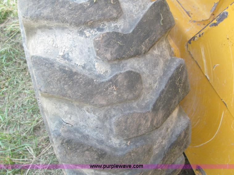 image for item F7134 John Deere 325 skid steer