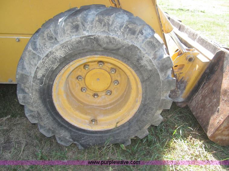 image for item F7134 John Deere 325 skid steer