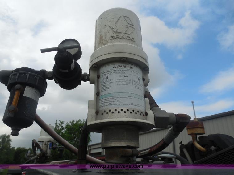 image for item I1336 2006 Ford F550 flatbed lube truck