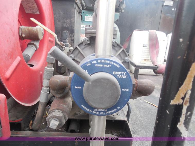 image for item I1336 2006 Ford F550 flatbed lube truck