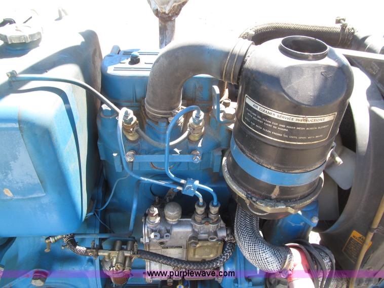 image for item E4505 Ford 1500 MFWD utility tractor