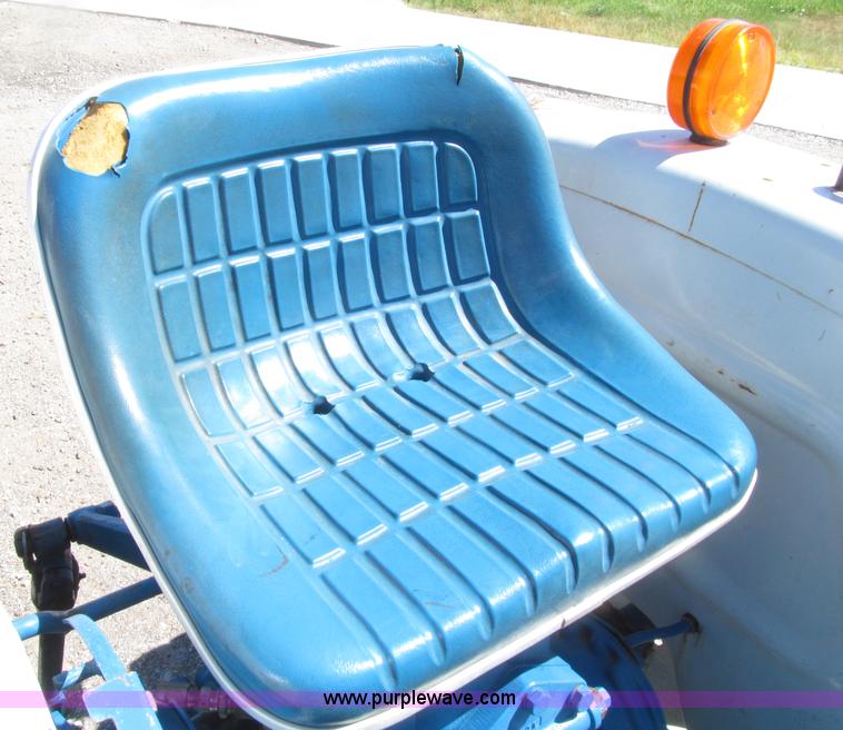 image for item E4505 Ford 1500 MFWD utility tractor