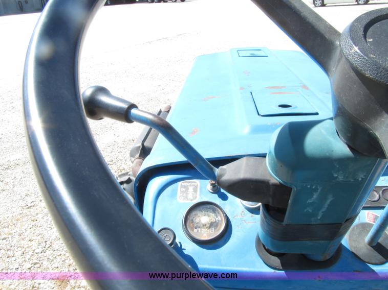 image for item E4506 Ford 1510 MFWD tractor
