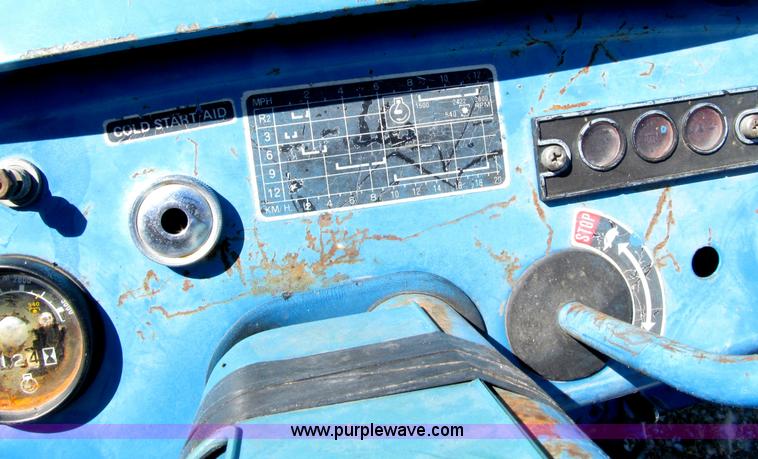 image for item E4506 Ford 1510 MFWD tractor