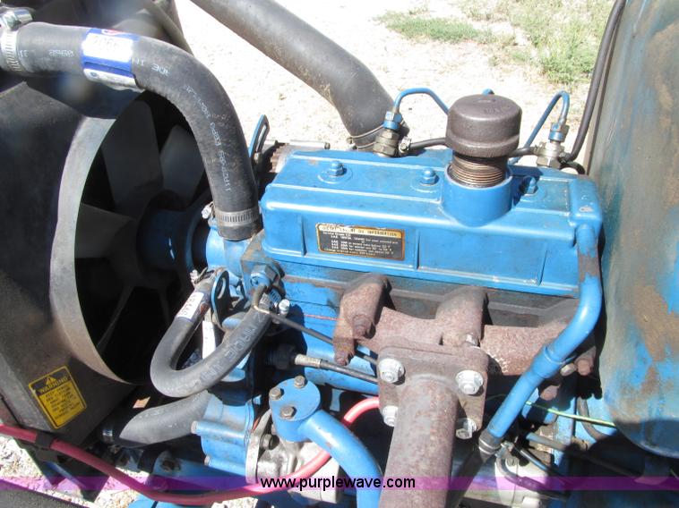 image for item E4506 Ford 1510 MFWD tractor