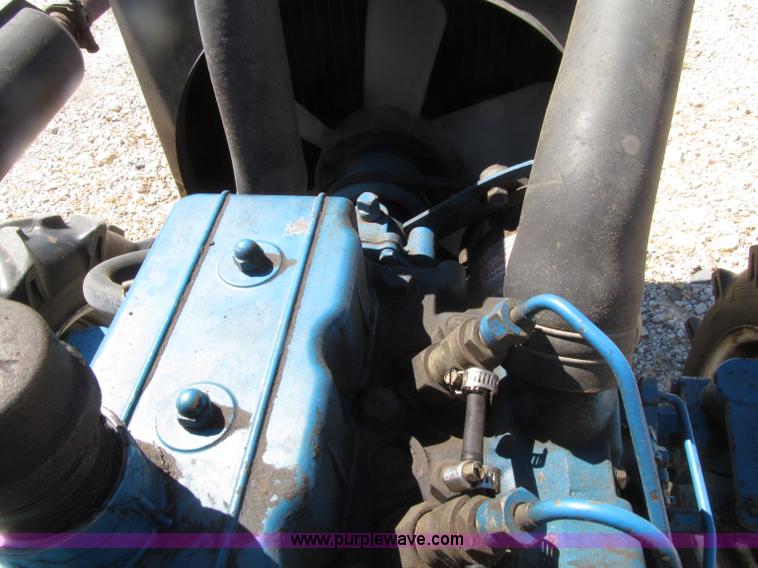 image for item E4506 Ford 1510 MFWD tractor