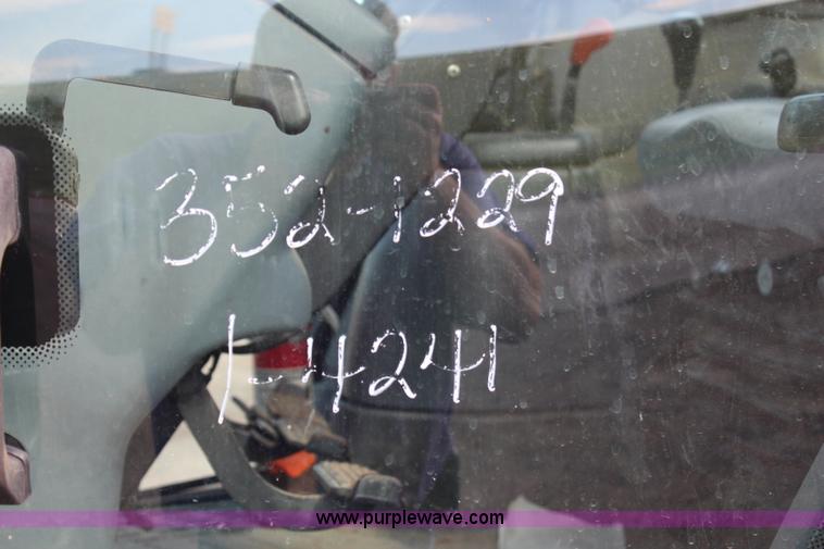 image for item H6909 1999 Ford New Holland TS100 tractor