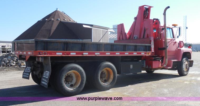 image for item I1378 1994 Ford LNT8000 tilt bed truck