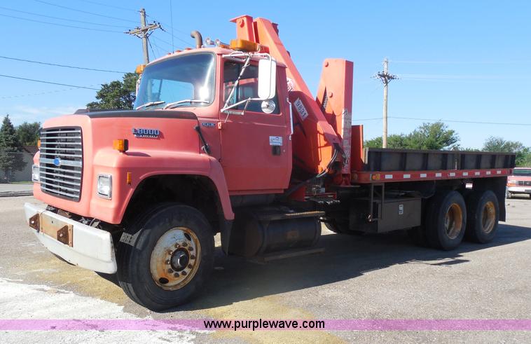 image for item I1378 1994 Ford LNT8000 tilt bed truck