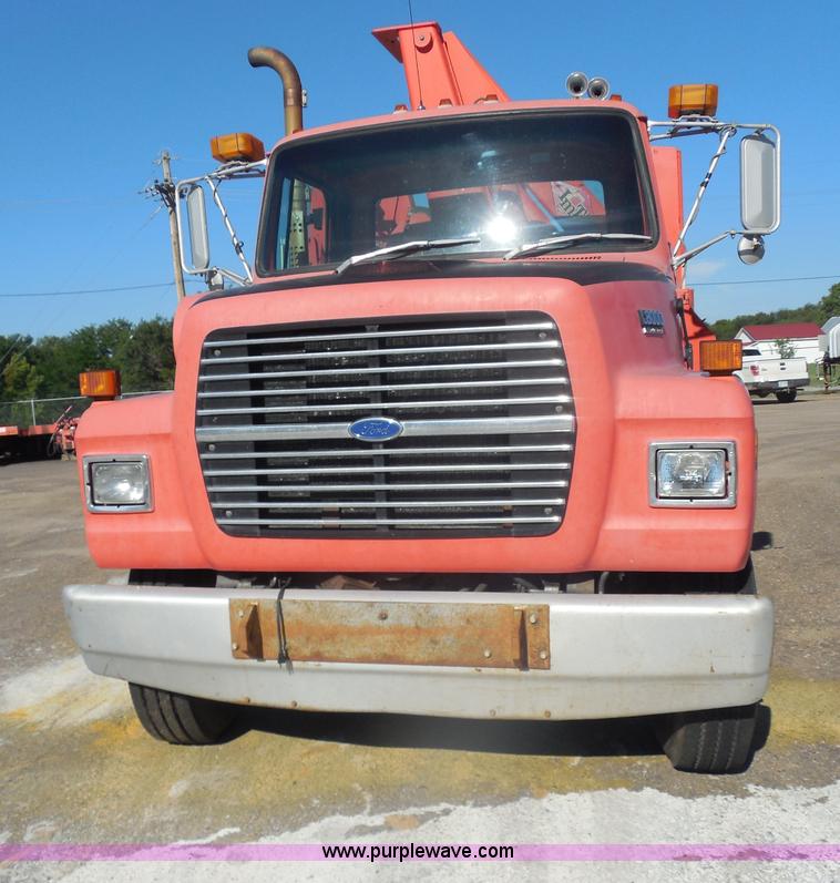 image for item I1378 1994 Ford LNT8000 tilt bed truck