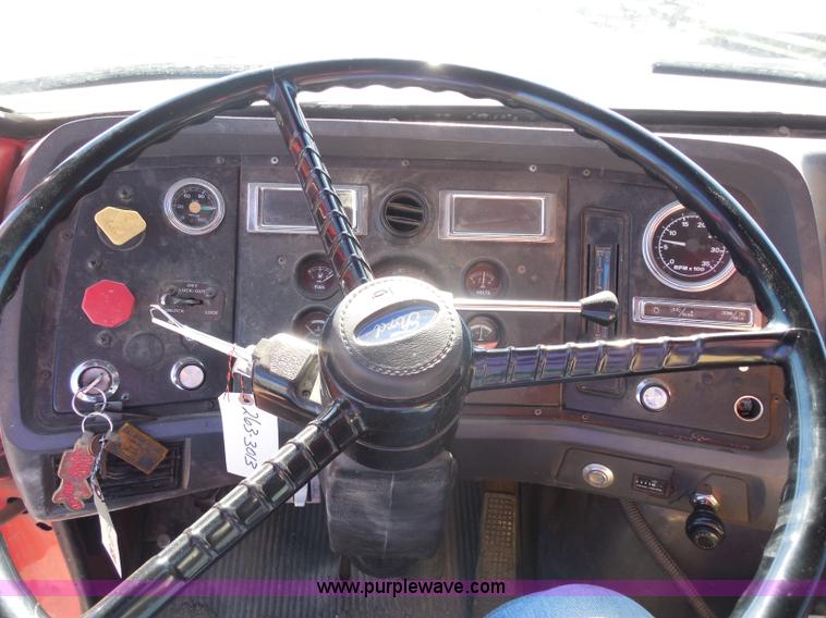 image for item I1378 1994 Ford LNT8000 tilt bed truck